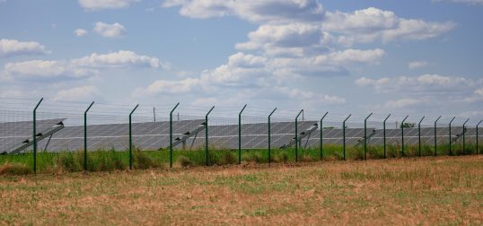 solar panels in the middle of a field on a sunny day, Ukraine